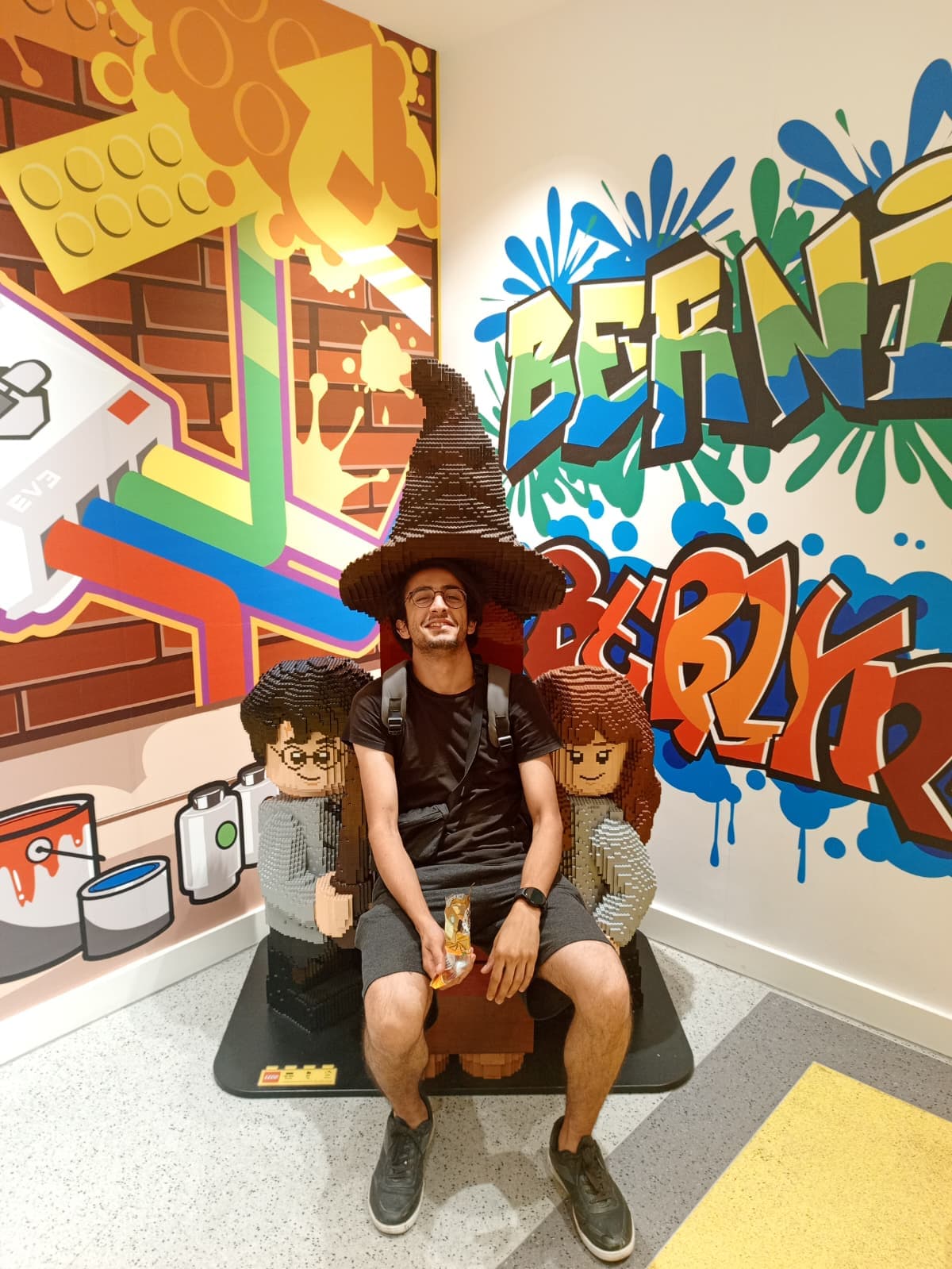 Wearing a LEGO wizard hat at the LEGO store in Berlin.