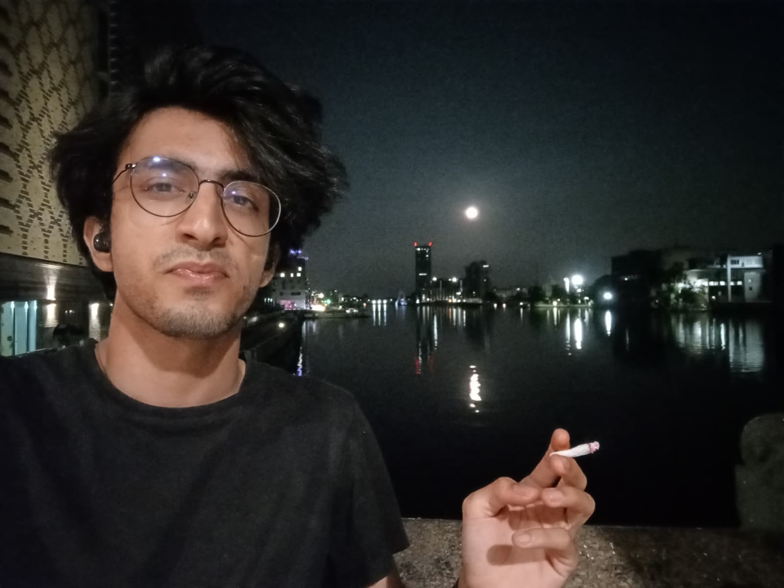Smoking by the Spree River under the moonlight.