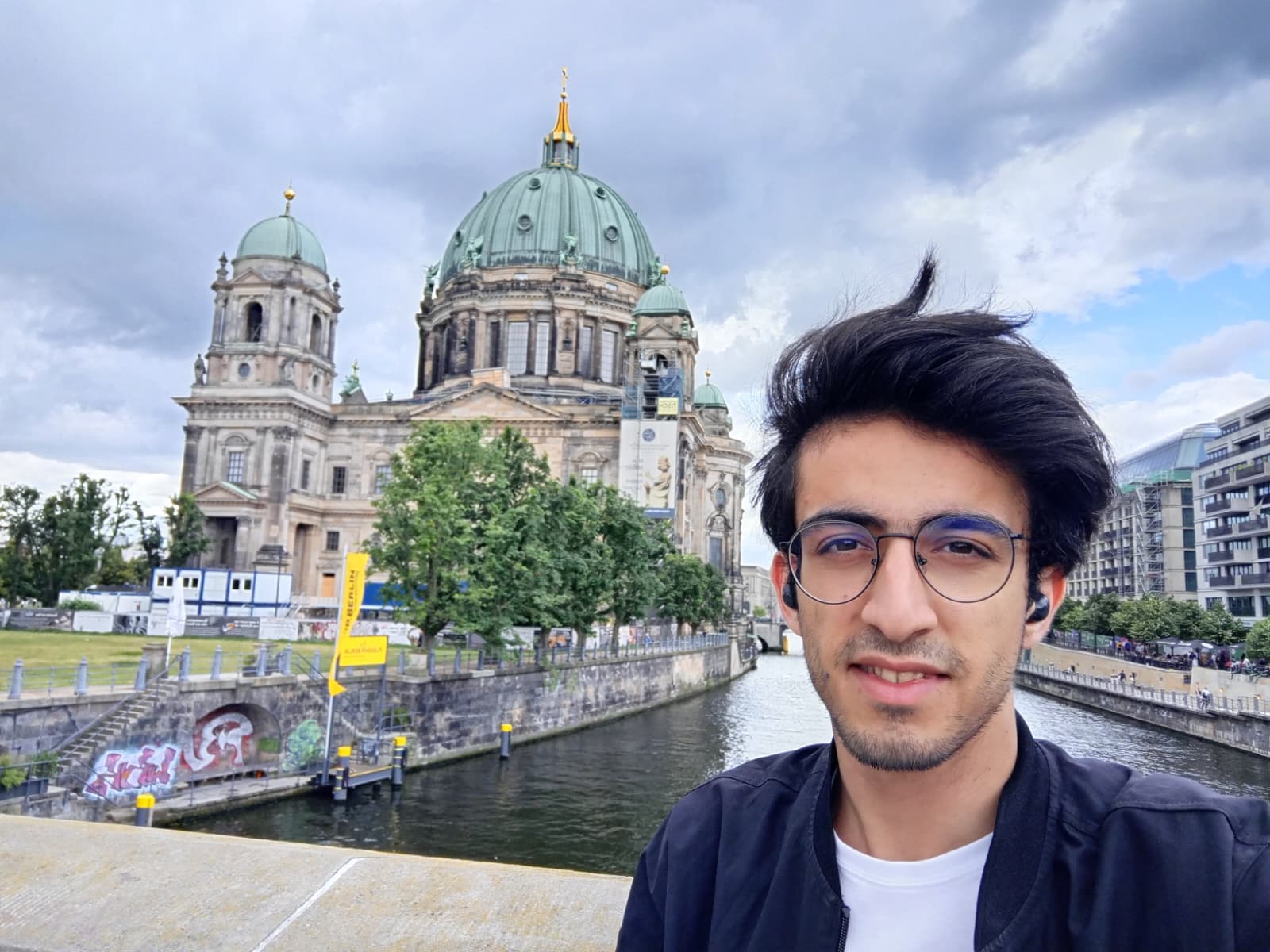 Posing by the Berlin Cathedral with the river flowing behind.