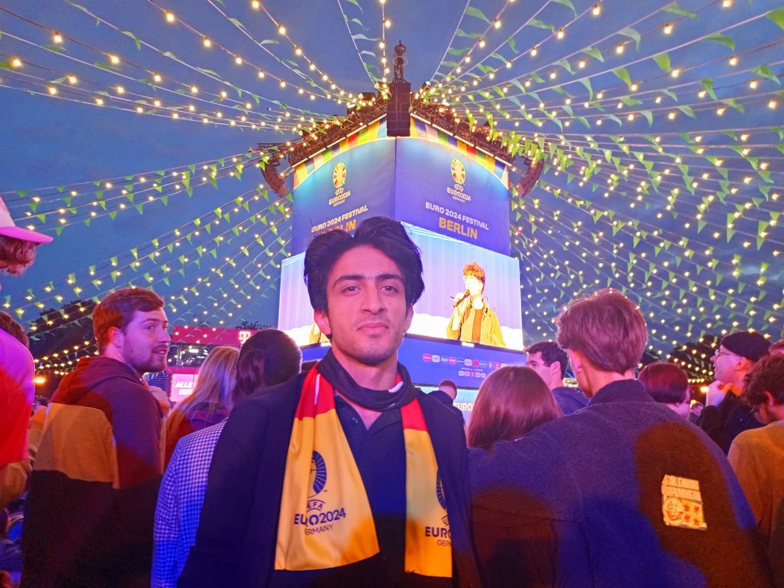 At the UEFA Euro 2024 fan festival in Berlin, surrounded by lights and excitement.