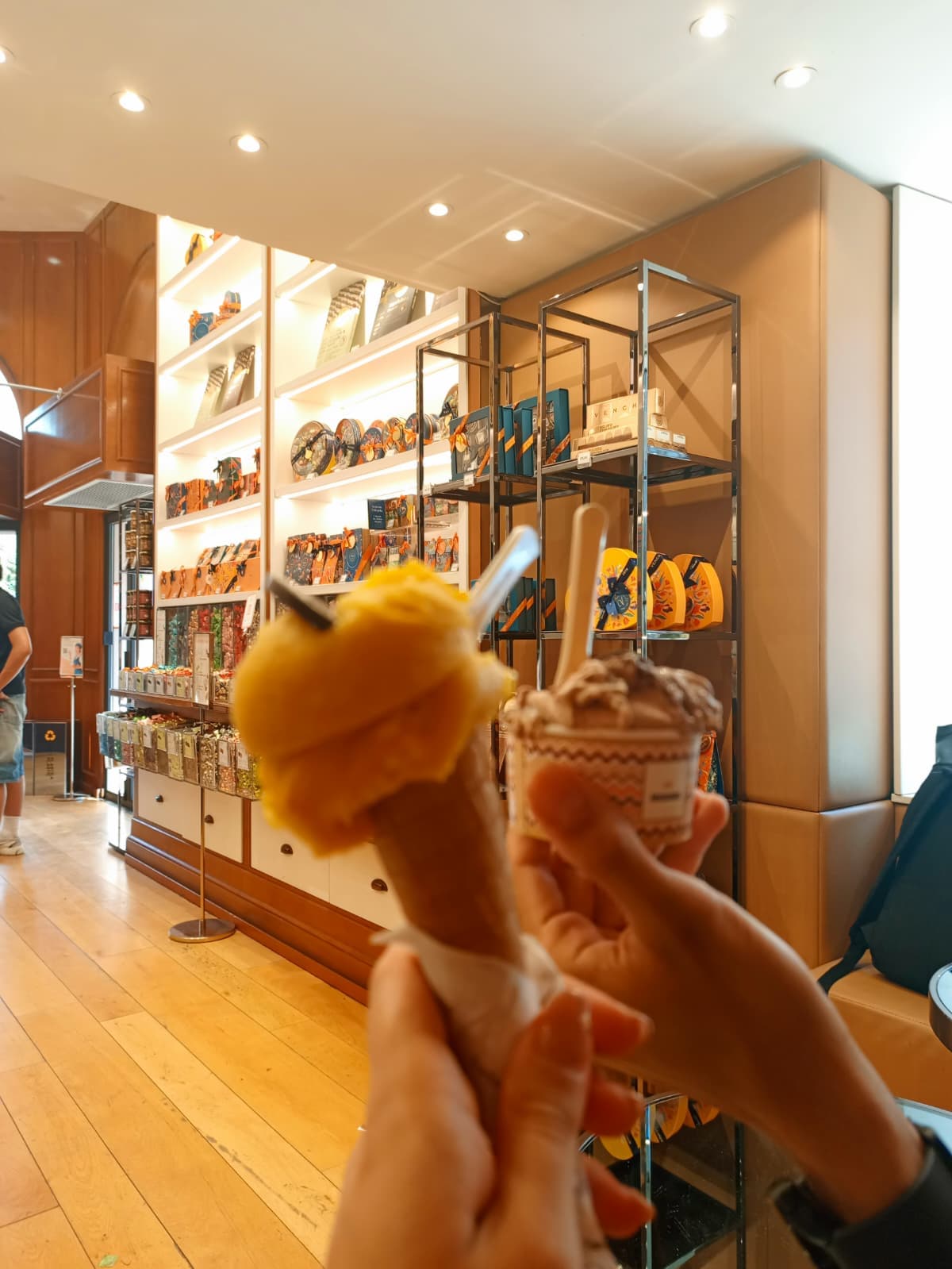 Enjoying gelato inside a shop.