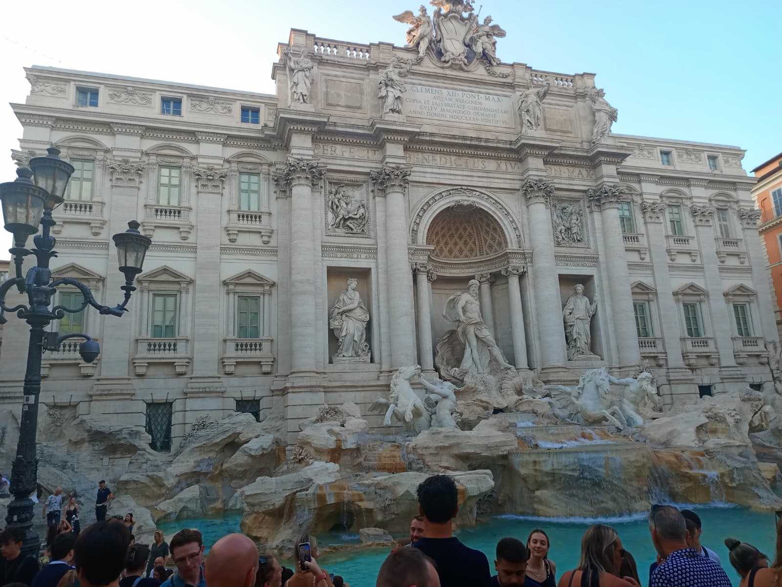 Crowds gathered at the Trevi Fountain, waiting to toss a coin and make a wish.