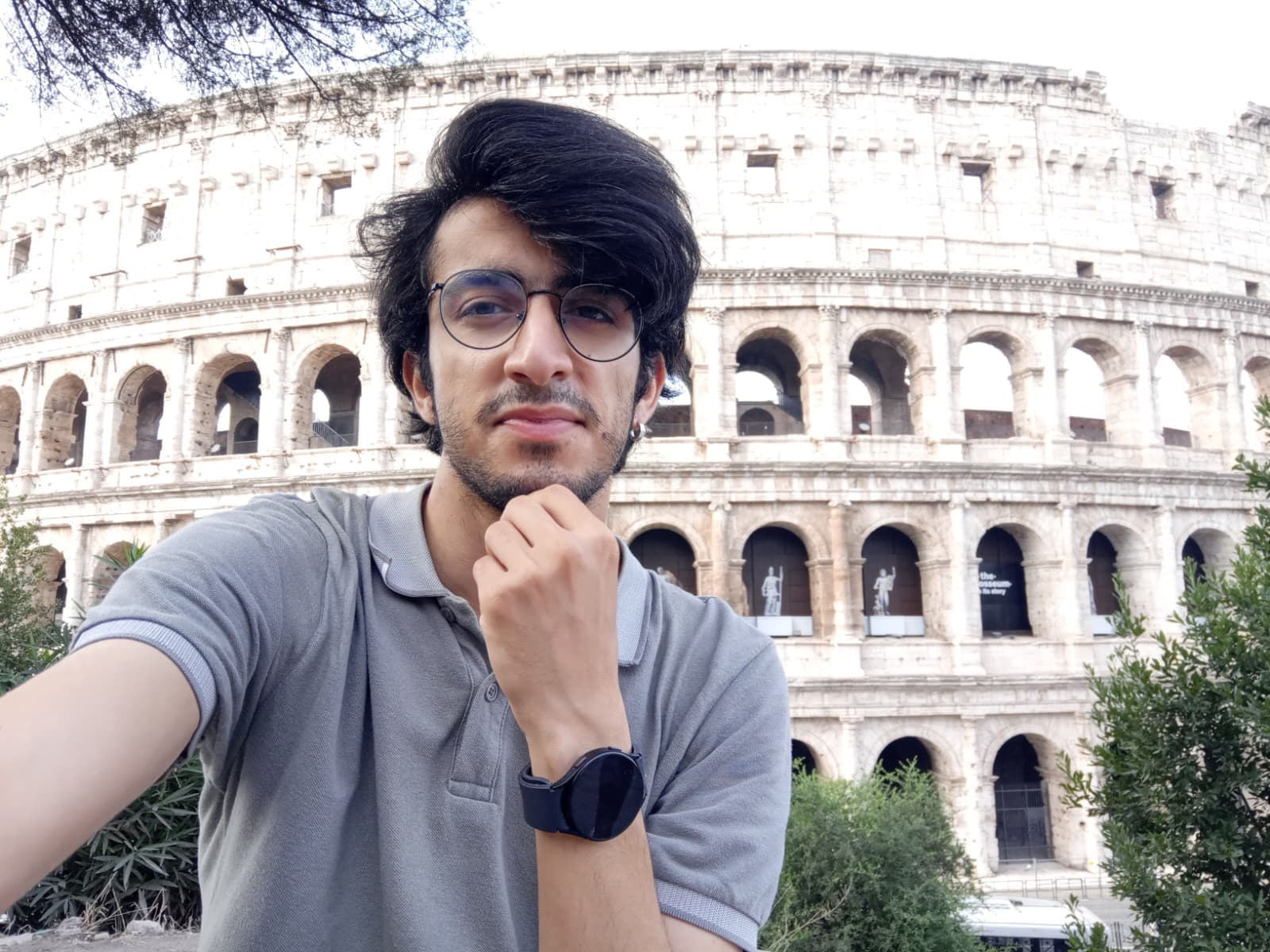 Sitting in front of the Colosseum, soaking in the history.