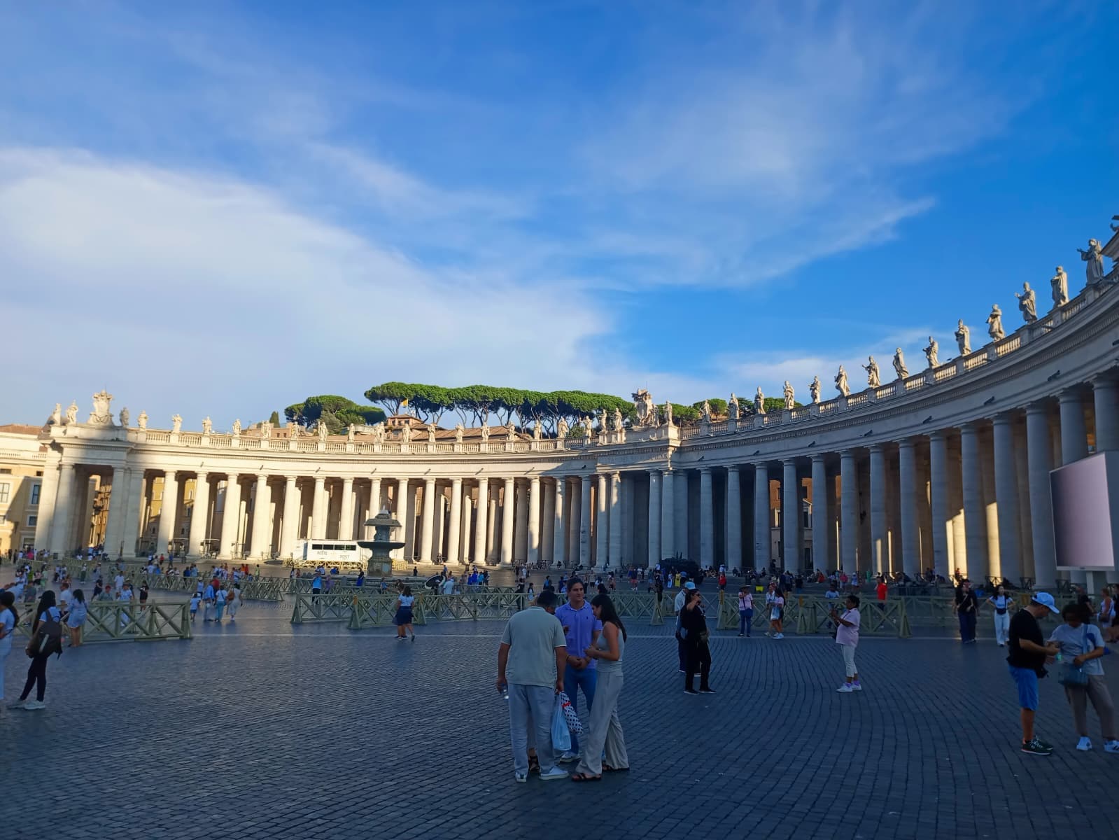 Walking through St. Peter’s Square, framed by Bernini’s majestic colonnades.