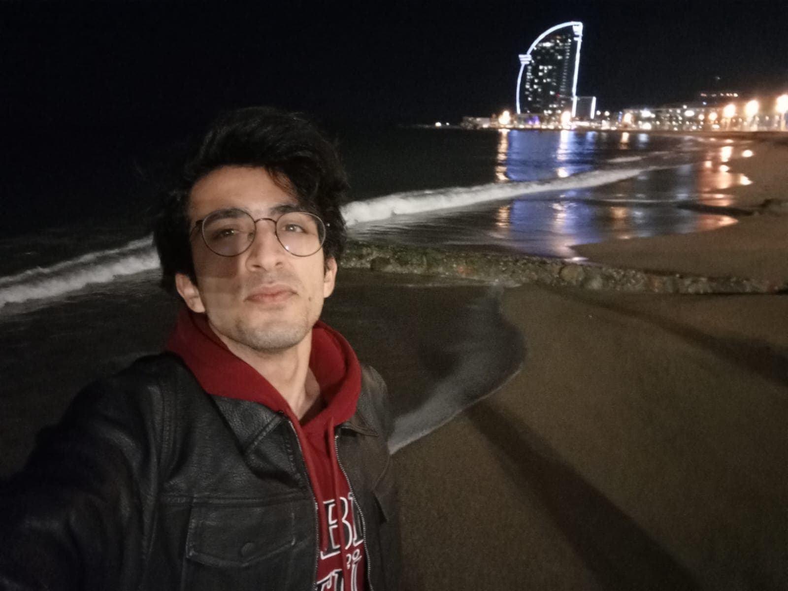 Night walk at Barceloneta Beach with the W Hotel shining in the background.