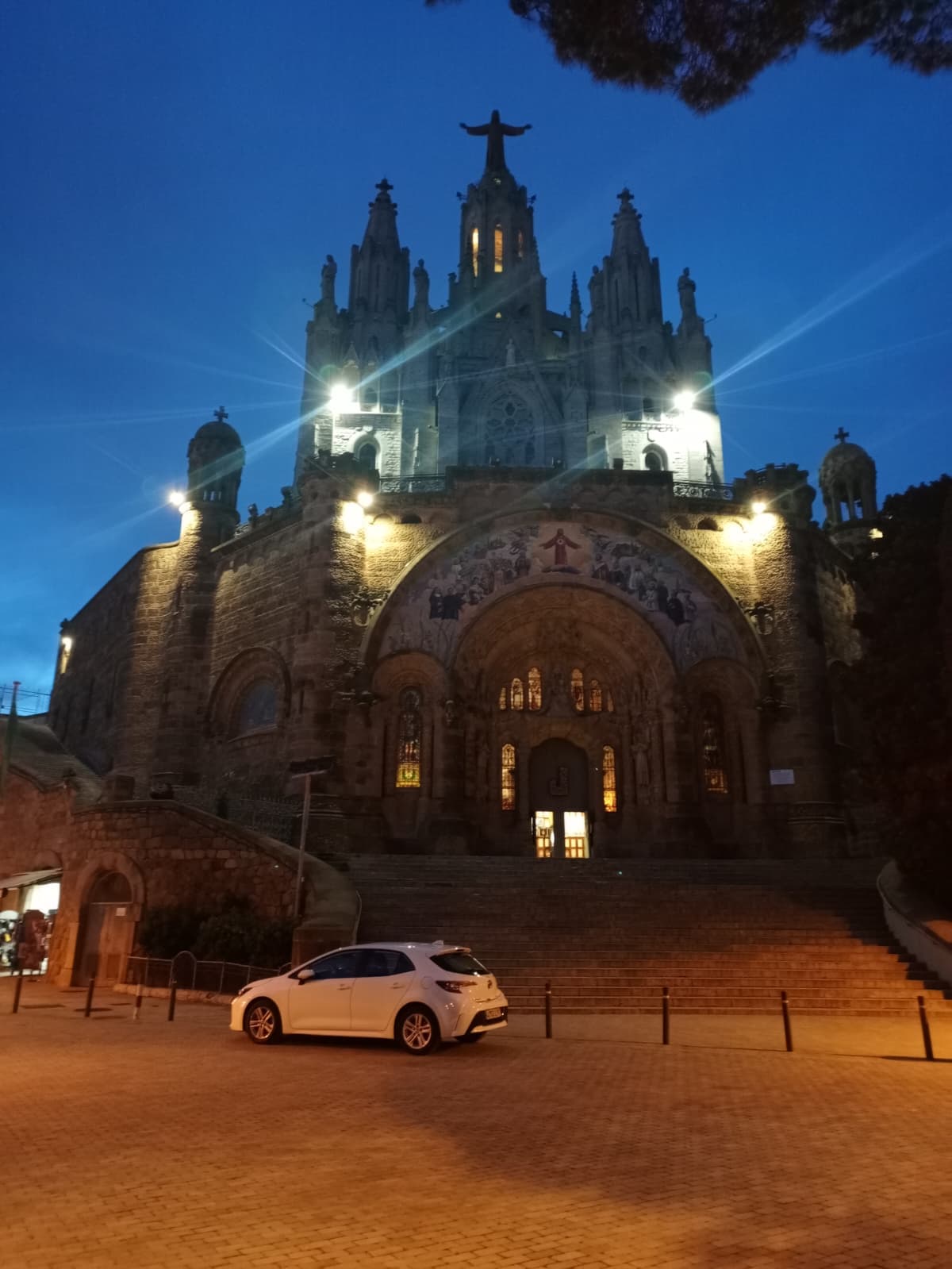 Temple of the Sacred Heart of Jesus at Tibidabo illuminated at dusk.