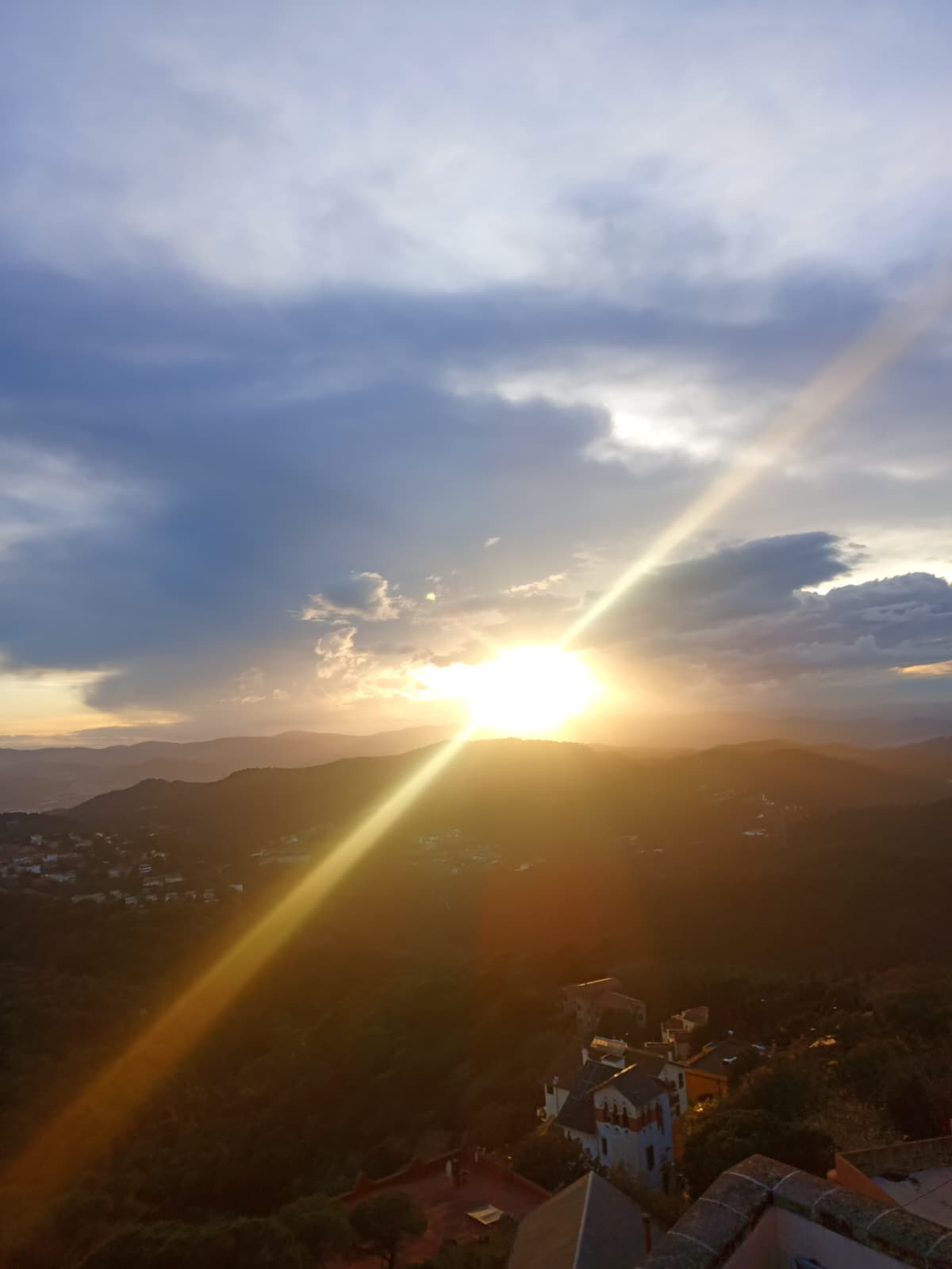 Golden sunset view over the mountains from Tibidabo.